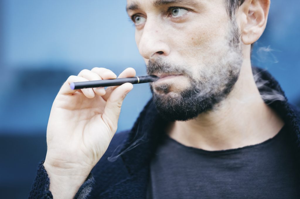 Man smoking E-cigarette